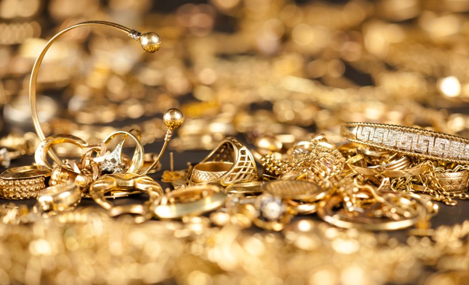 Scrap Gold Collection Table of scrap gold being inspected.Focal point on the two bracelets.